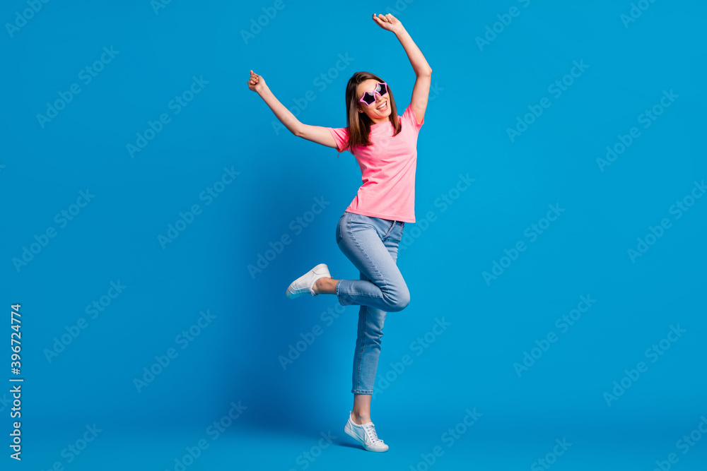 Full length body size photo of cheerful happy girl dancing at disco party in summer party isolated on vivid blue color background