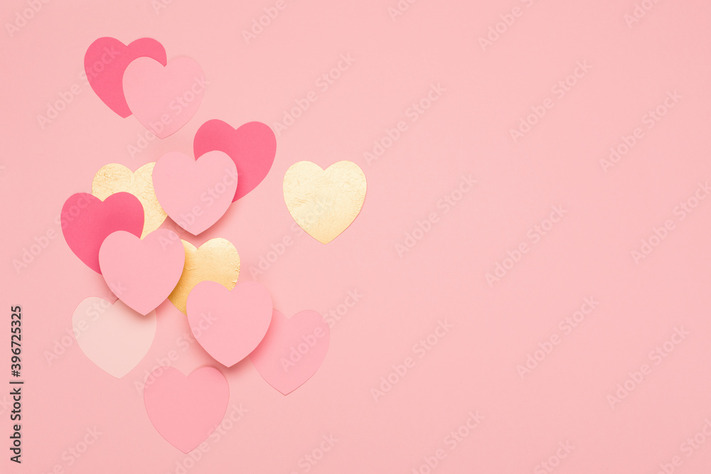 Pink, golden paper hearts on pastel pink background. Festive holiday greeting card for Valentines, Birthday, Woman or Mothers Day.