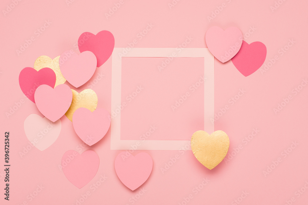 Pink, gold paper hearts and empty frame on pastel pink background. Valentines day concept. Pink, gold paper hearts and empty frame on pastel pink background. Valentines day concept.