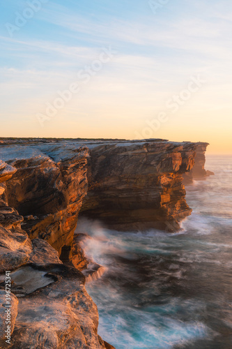 Rock cliff seascape view under the morning sunlight. © AlexandraDaryl