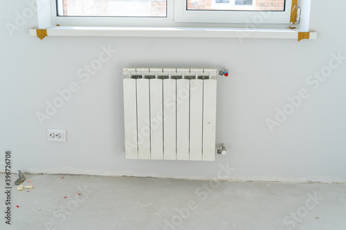 Wallpaper Mural Heating radiator under window in room under renovation. Closeup. Torontodigital.ca