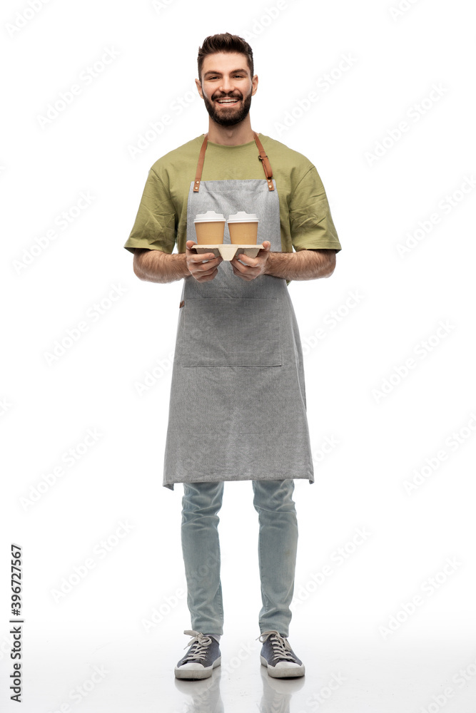 people, profession and job concept - happy smiling barman in apron holding takeaway coffee over white background people, profession and job concept - happy smiling barman in apron holding takeaway coffee over white background