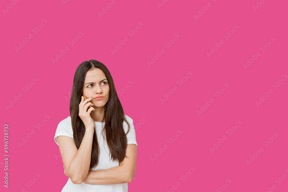 Portrait of woman talking on mobile phone isolated over pink background. Portrait of woman talking on mobile phone isolated over pink background.