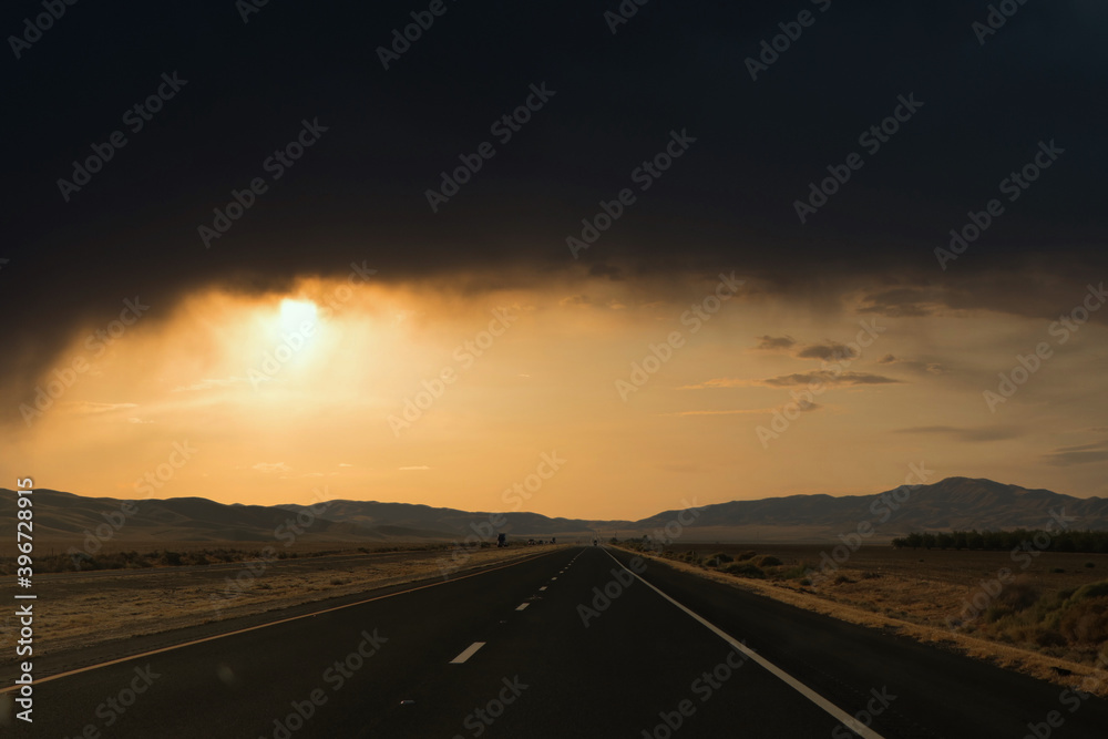 Photoshop landscape of roads, hills at sunset.