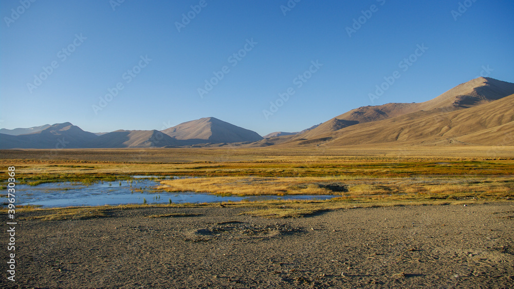 View at sunrise of high-altitude Bulunkul village surroundings off the Pamir Highway in Gorno-Badakshan, Tajikistan