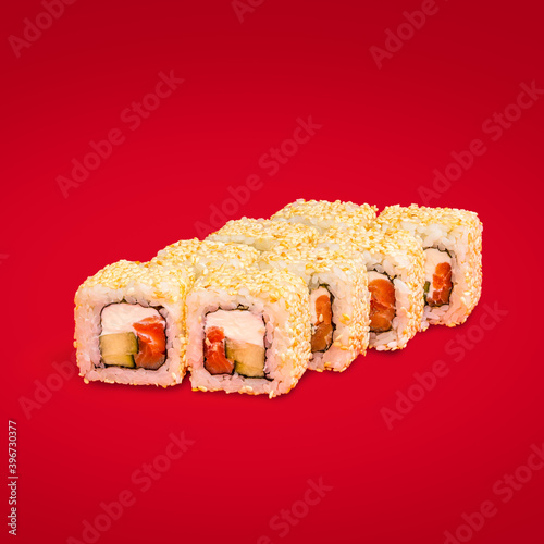 Obraz na płótnie Japanese cuisine sushi and rolls isolated on a red background w salonie