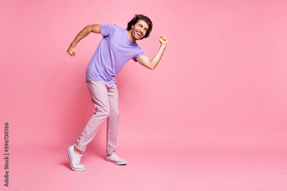 Portrait of nice optimistic person having great time at club violet outfit isolated on pastel pink color background Portrait of nice optimistic person having great time at club violet outfit isolated on pastel pink color background