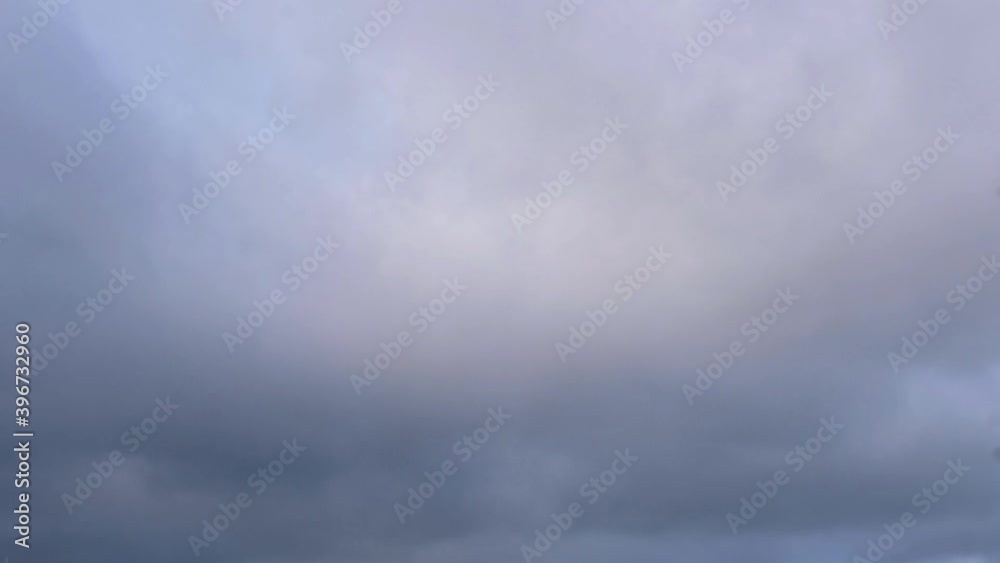 Time lapse of stormy gray and blue clouds passing by Time lapse of stormy gray and blue clouds passing by