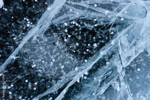 Horizontal oriented close-up photo of a frozen lake
