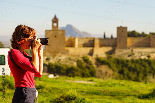 Tourist take photo in Antequera city, Spain. photo