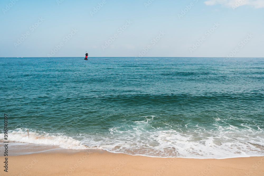 calm waves, waves and lighthouses along Gyeongpo Beach.