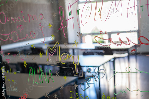 View of an empty classroom from the glass door