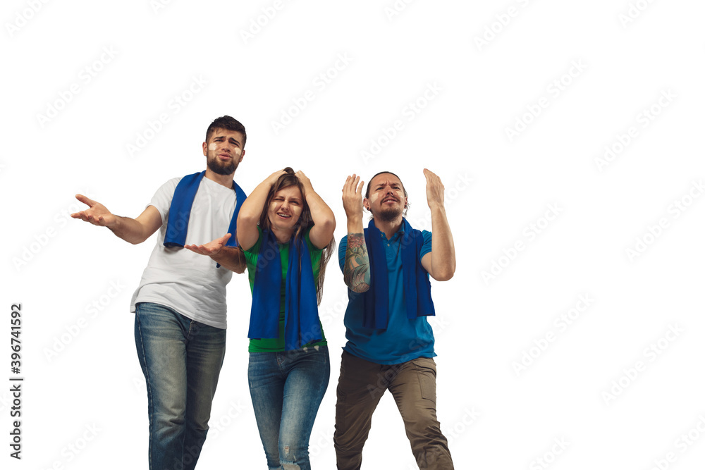 Chagrin. Three soccer fans woman and men cheering for favourite sport team with bright emotions isolated on white studio background. Looking excited, supporting. Concept of sport, fun, support.
