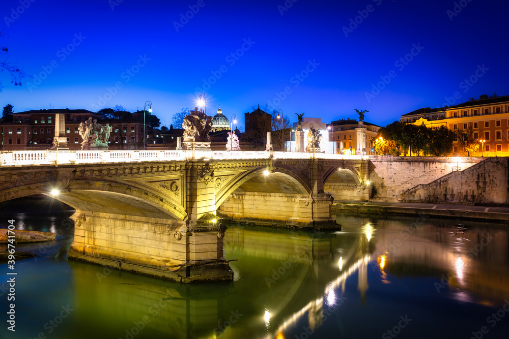 Saint Angel Castle over the Tiber river in Rome at night, Italy