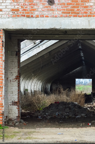 Facade of abandoned rural house in a farm against landscape