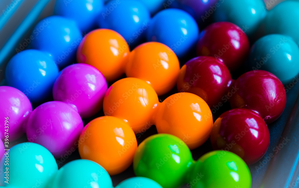 Children's puzzle. Bright colored balls. They lie next to each other. Children's puzzle. Bright colored balls. They lie next to each other.