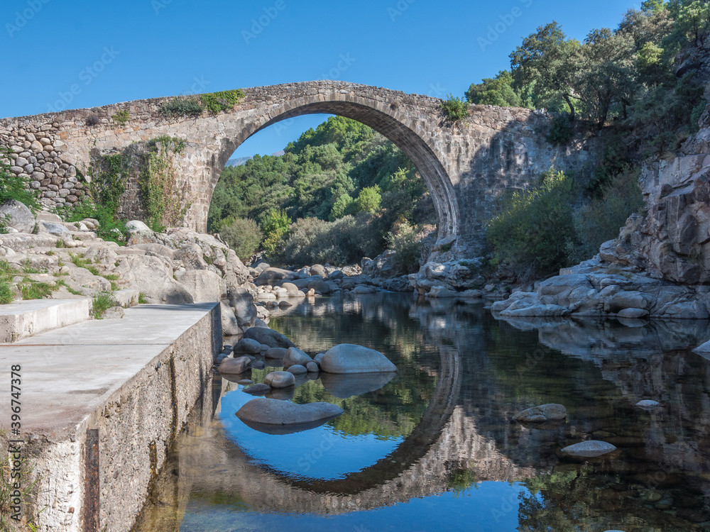Stone bridge over the canyon of the Alardos river (Garganta de Alardos). Madrigal de la Vera, Caceres, Extremadura, Spain Stone bridge over the canyon of the Alardos river (Garganta de Alardos). Madrigal de la Vera, Caceres, Extremadura, Spain