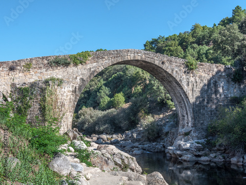 Garganta de Alardos. Roman bridge over the canyon of the Alardos river in Madrigal de la Vera, Caceres, Extremadura, Spain