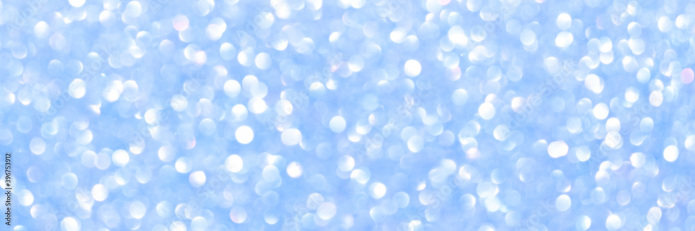 An abstract blue background with sparkle lights and bokeh. Useful as Christmas background or greeting card. An abstract blue background with sparkle lights and bokeh. Useful as Christmas background or greeting card.