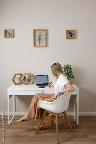  woman works at a laptop in the home office © alas_spb