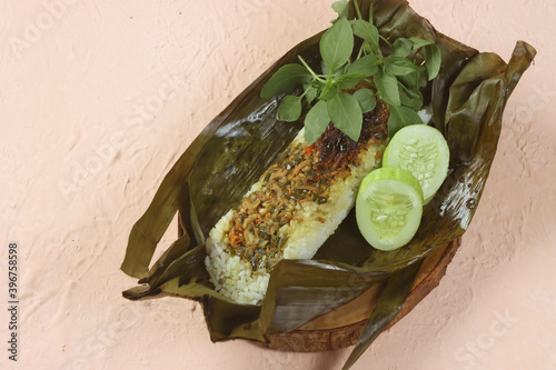 Indonesian traditional cuisine: Nasi Bakar teri or grilled rice with ...