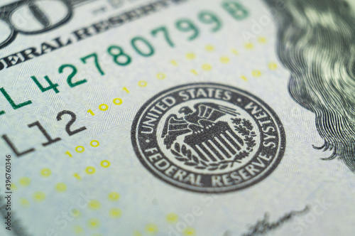 Stamp on a dollar banknote with an eagle and the words United states federal reserve system