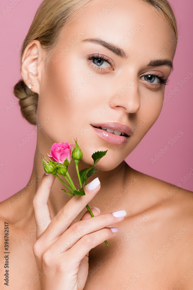 Fototapeta premium beautiful blonde woman with perfect skin and rose flower isolated on pink