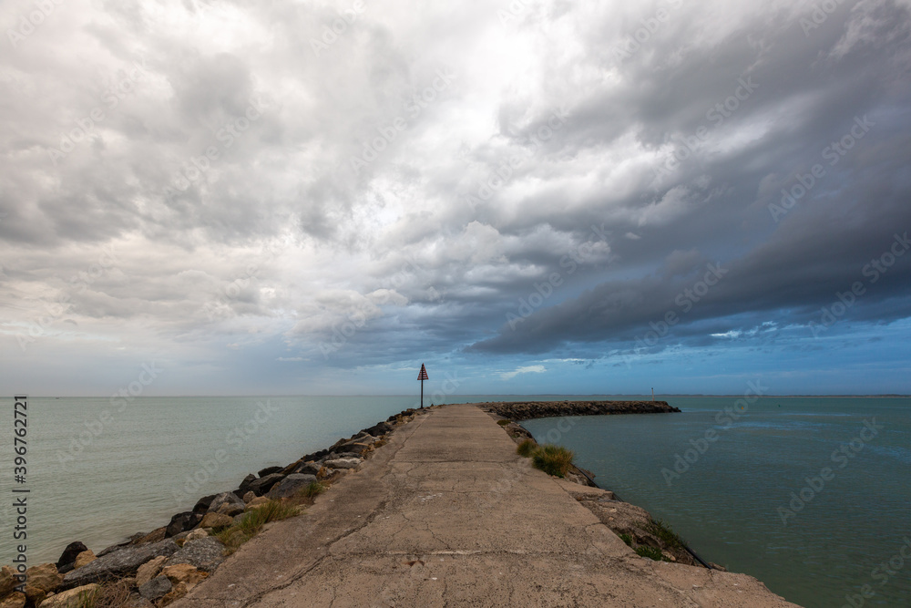 Wild weather and storm clouds above the Robe breakwater located in South Australia on November 11th 2020