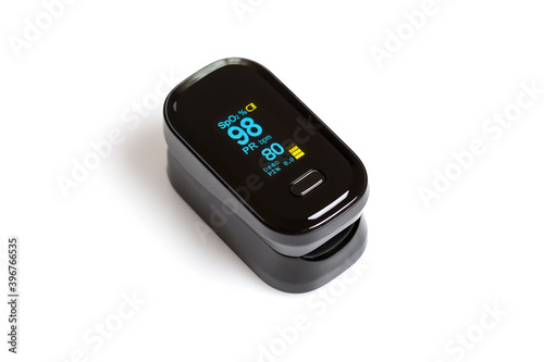 Pulse oximeter on white background with data of blood oxygen saturation and pulse. photo