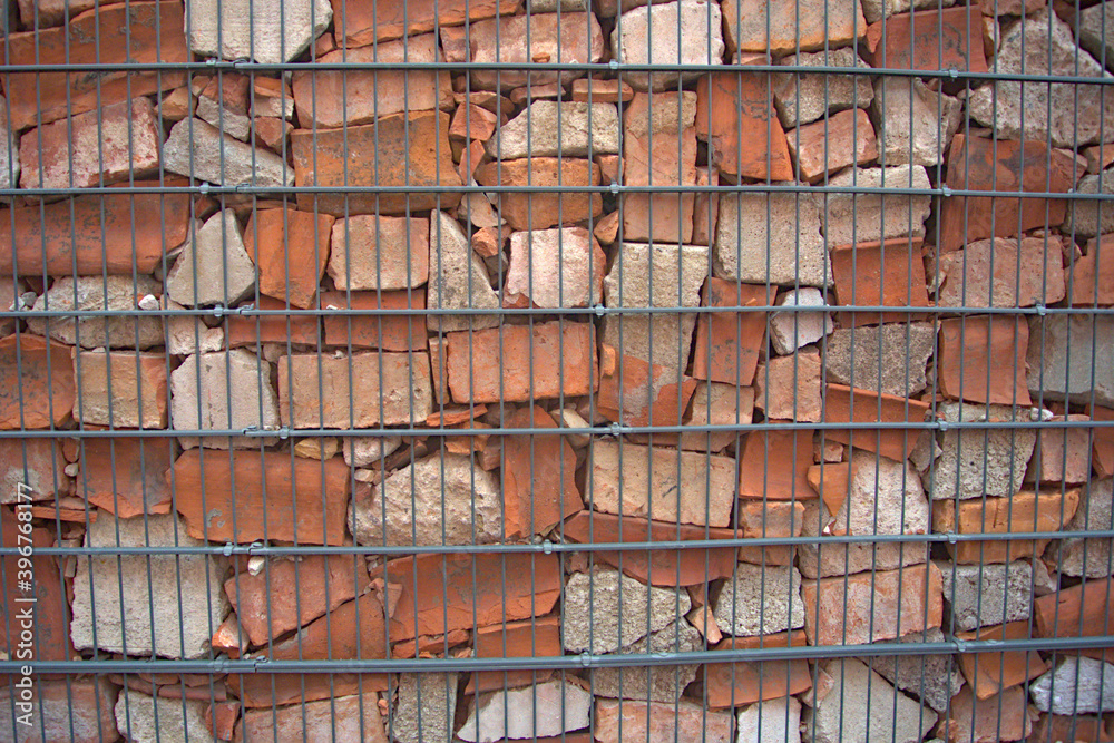 A fenced brick wall background