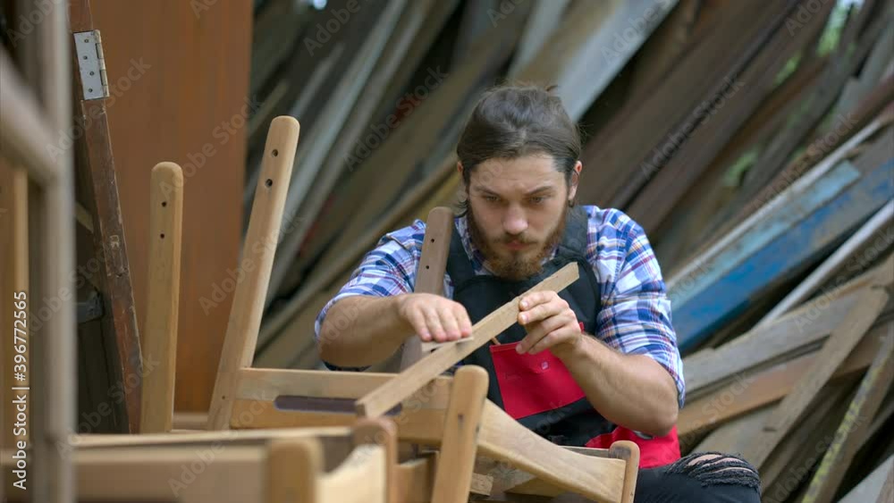 Carpenter man doing woodwork in workshop Carpenter man doing woodwork in workshop
