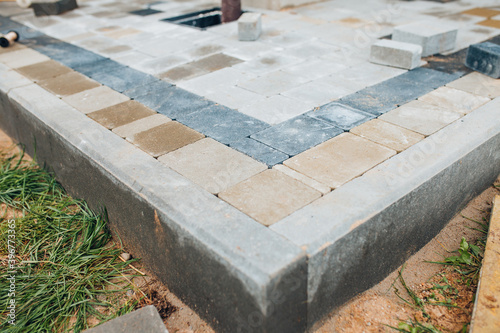 Εκτύπωση καμβά Laying stone tiles on the foundation area around the perimeter of the house - ra