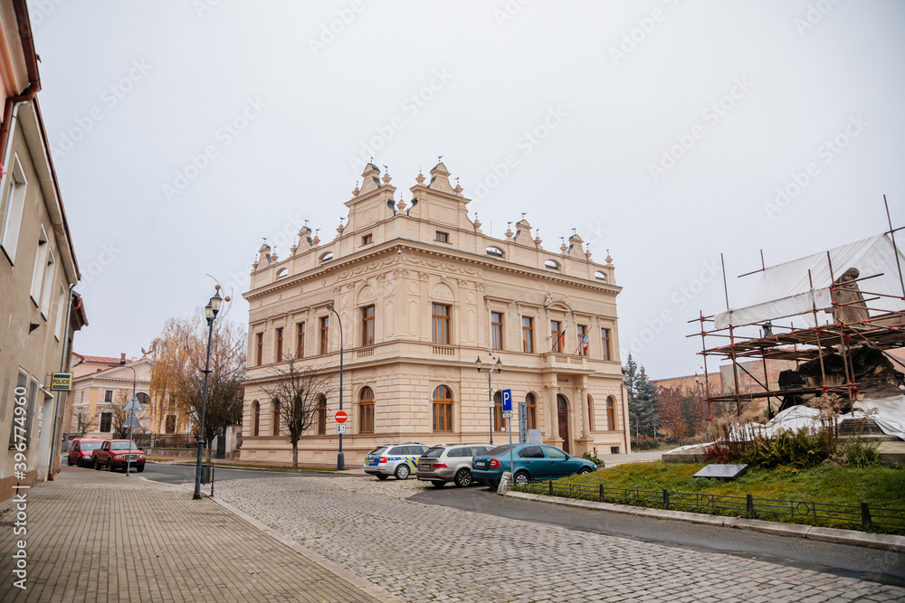 Historical neo renaissance building of city hall at main town Husovo Square at cloudy autumn day, Cesky Brod, Central Bohemia, Czech Republic