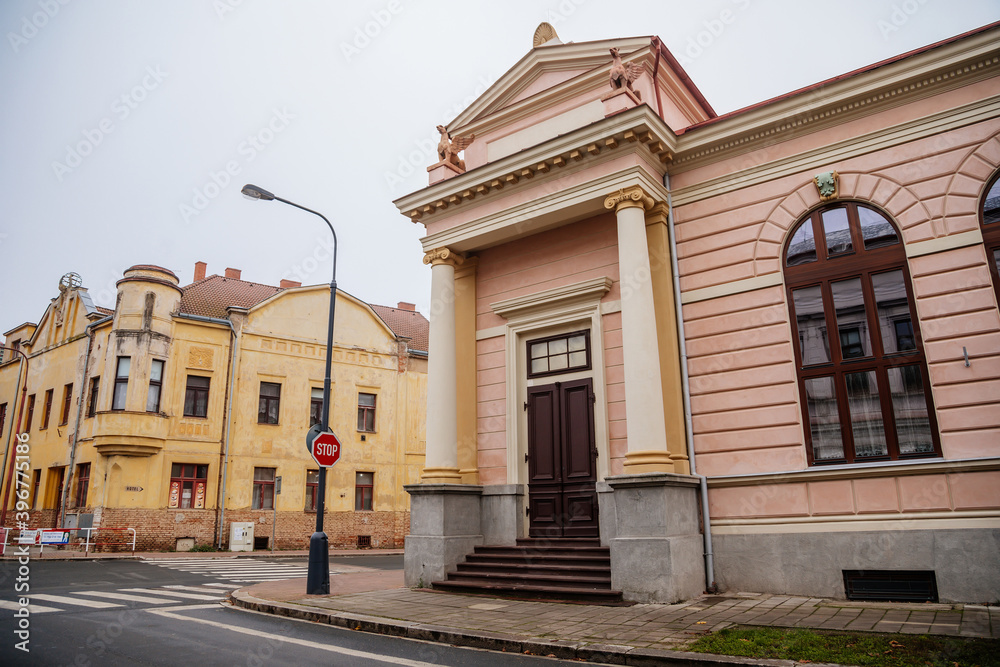 Historical neo classical building with columns and griffins on the roof, Sokolovna, gymnastics organization Sokol movement, autumn day, Cesky Brod, Central Bohemia, Czech Republic