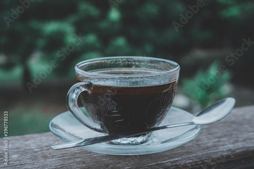 cup of coffee on wooden table