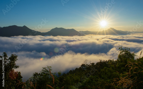 beautiful sunrise over mountain with fog in the morning	