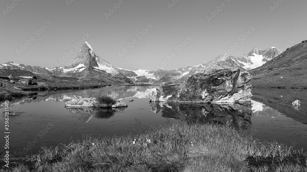 Sunrise view on Bernese range above Bachalpsee lake. Peaks Eiger, Jungfrau, Faulhorn in famous location in Switzerland alps, Grindelwald valley