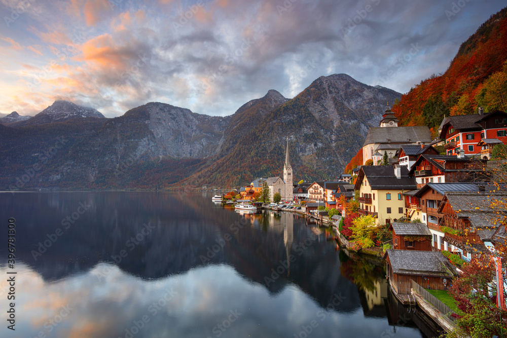 Hallstatt, Austria. Cityscape image of iconic alpine village Hallstatt at dramatic autumn sunrise.