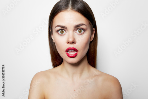 Attractive woman Surprised look red lips open mouth clean skin 