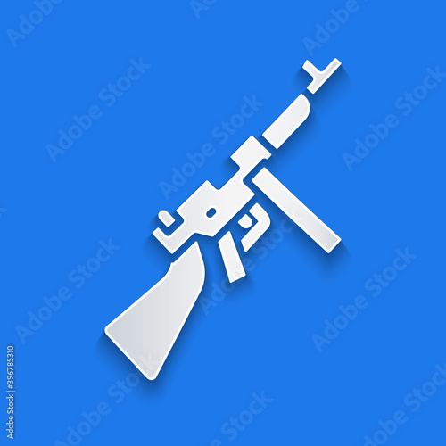 Paper cut Thompson tommy submachine gun icon isolated on blue background. American submachine gun. Paper art style. Vector.