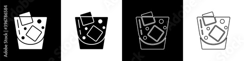 Set Glass of whiskey and ice cubes icon isolated on black and white background. Vector.