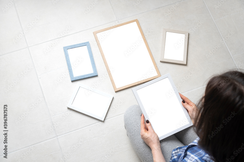 Girl with a blank empty frames. Background with copy space.