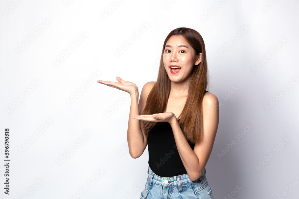 Portrait young beautiful Asian woman happy smile on isolated white background. Beautiful Asian girl smiling and with hand sign and copy space. Casual woman, Asian student smiling looking happy. Portrait young beautiful Asian woman happy smile on isolated white background. Beautiful Asian girl smiling and with hand sign and copy space. Casual woman, Asian student smiling looking happy.