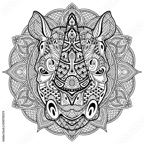 Rhino. Rhinoceros. Ornamental Animal head. Hand drawn of rhino head in zentangle style. The head of a Rhinoceros is drawn by hand with ink, with ethnic patterns.  Coloring antistress.
