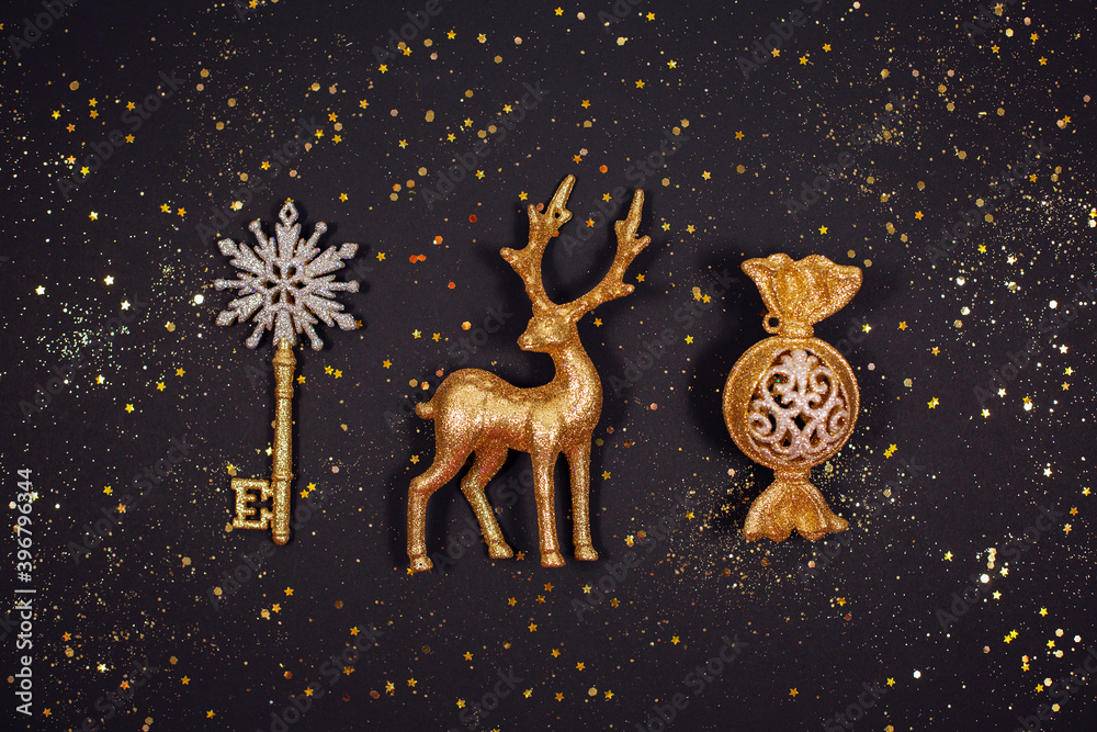 Beautiful Golden sparkling Christmas decoration with glitters on black background Beautiful Golden sparkling Christmas decoration with glitters on black background