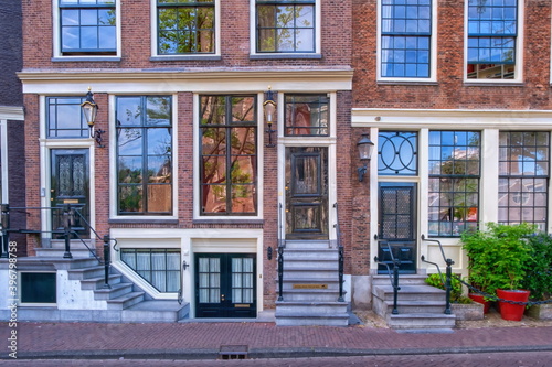 Canvas Print Typical buildings facade in Amsterdam by day, Netherlands