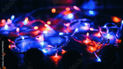 festive background.colored lights on a black background