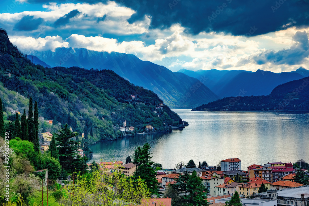 Winter panorama on the city of Bellano and on the center of Lake Como on the embankment of the Swiss mounts Lombardy Italy