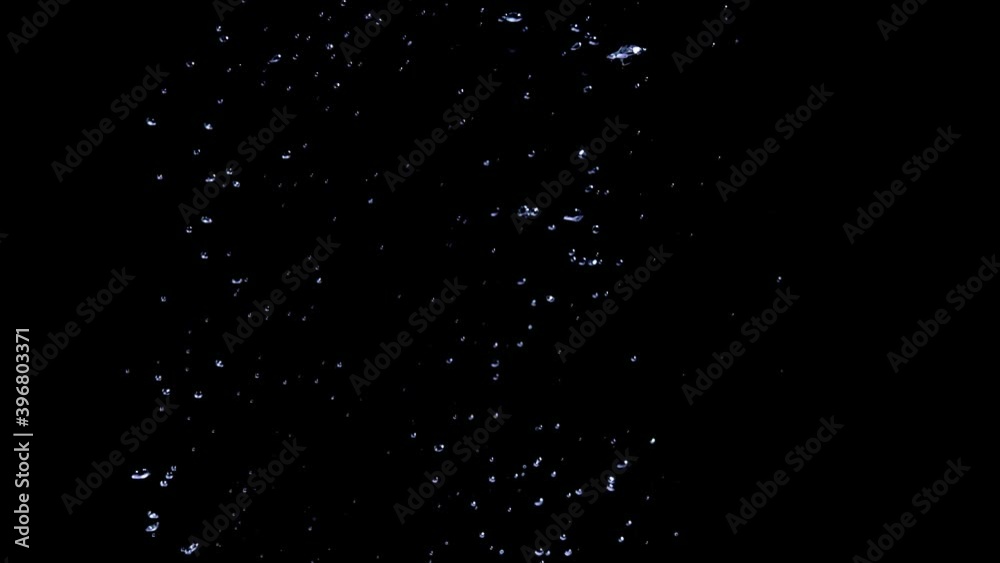air bubbles in water in front of black background