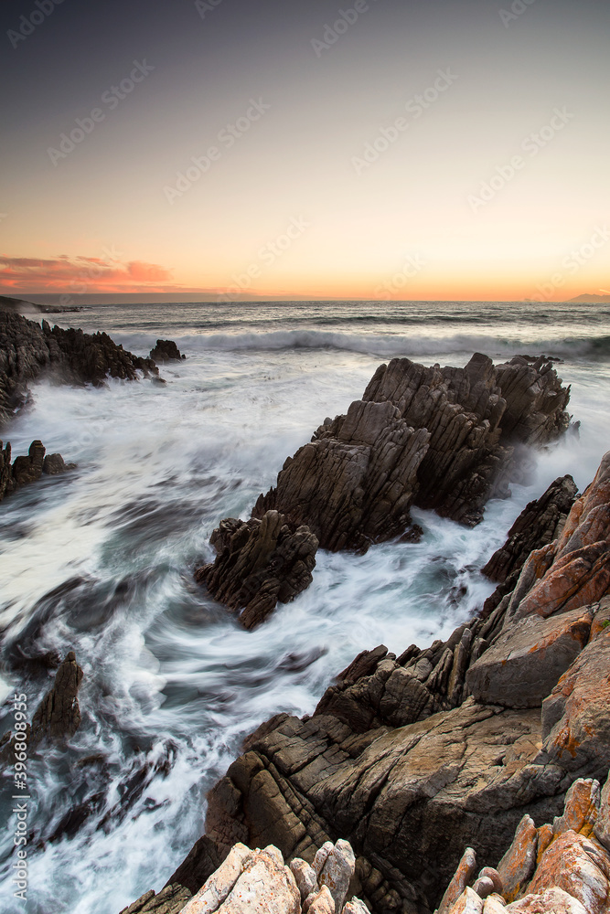 Vertical Wide angle view over the cliffs of De Kelders in Gansbaai Western Cape South Africa with stormy seas.